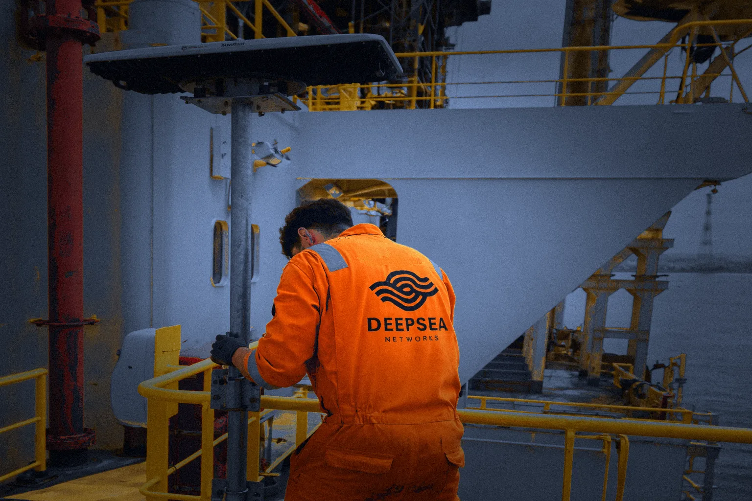 Deepsea engineer in orange coveralls on an offshore installation